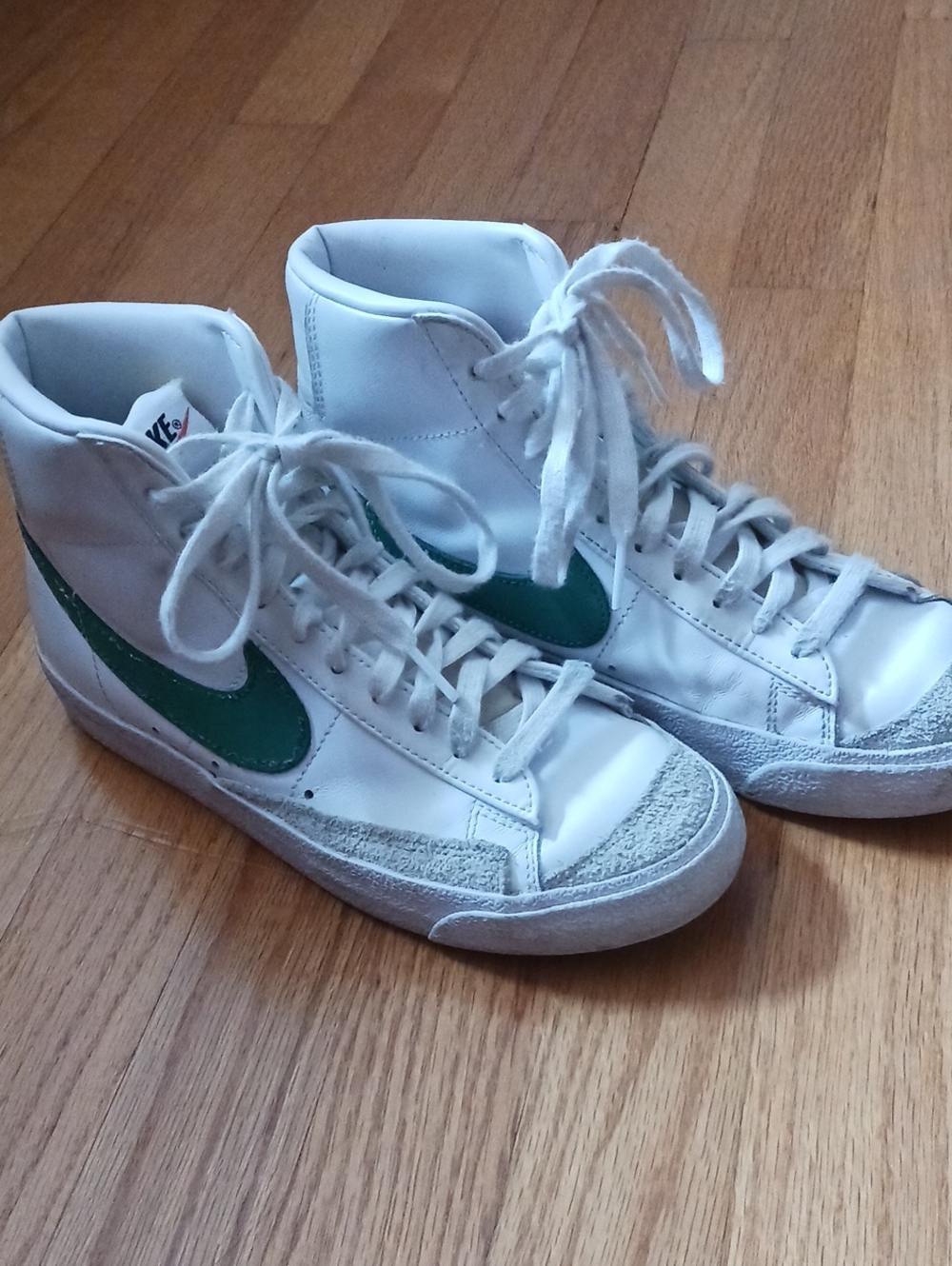 Nike White High-Top Sneakers with Green Swoosh